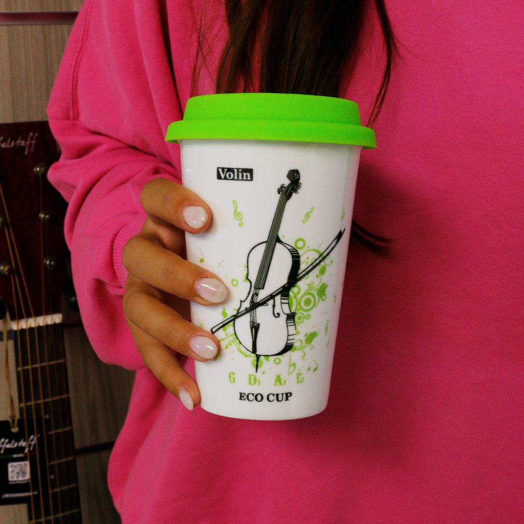 White ceramic violin-themed mug with green silicone lid